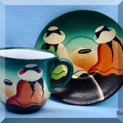 P08. Painted cup and saucer with Southwestern design. - $
